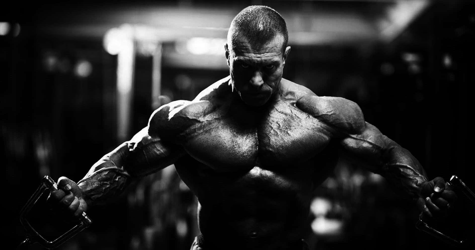 Intense Bodybuilder Workout Wallpaper