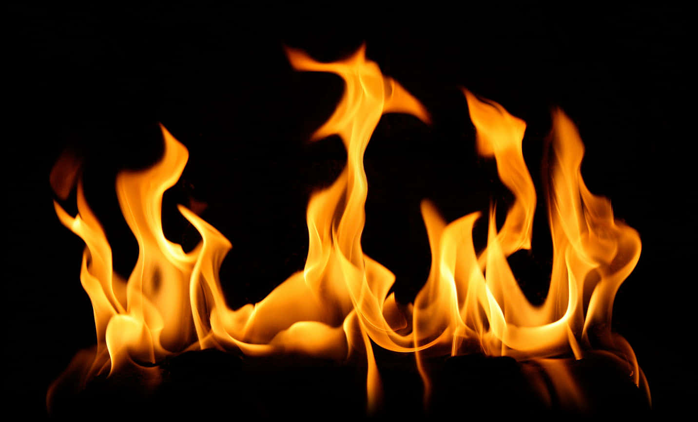 Intense Flames Dancingon Black Background PNG