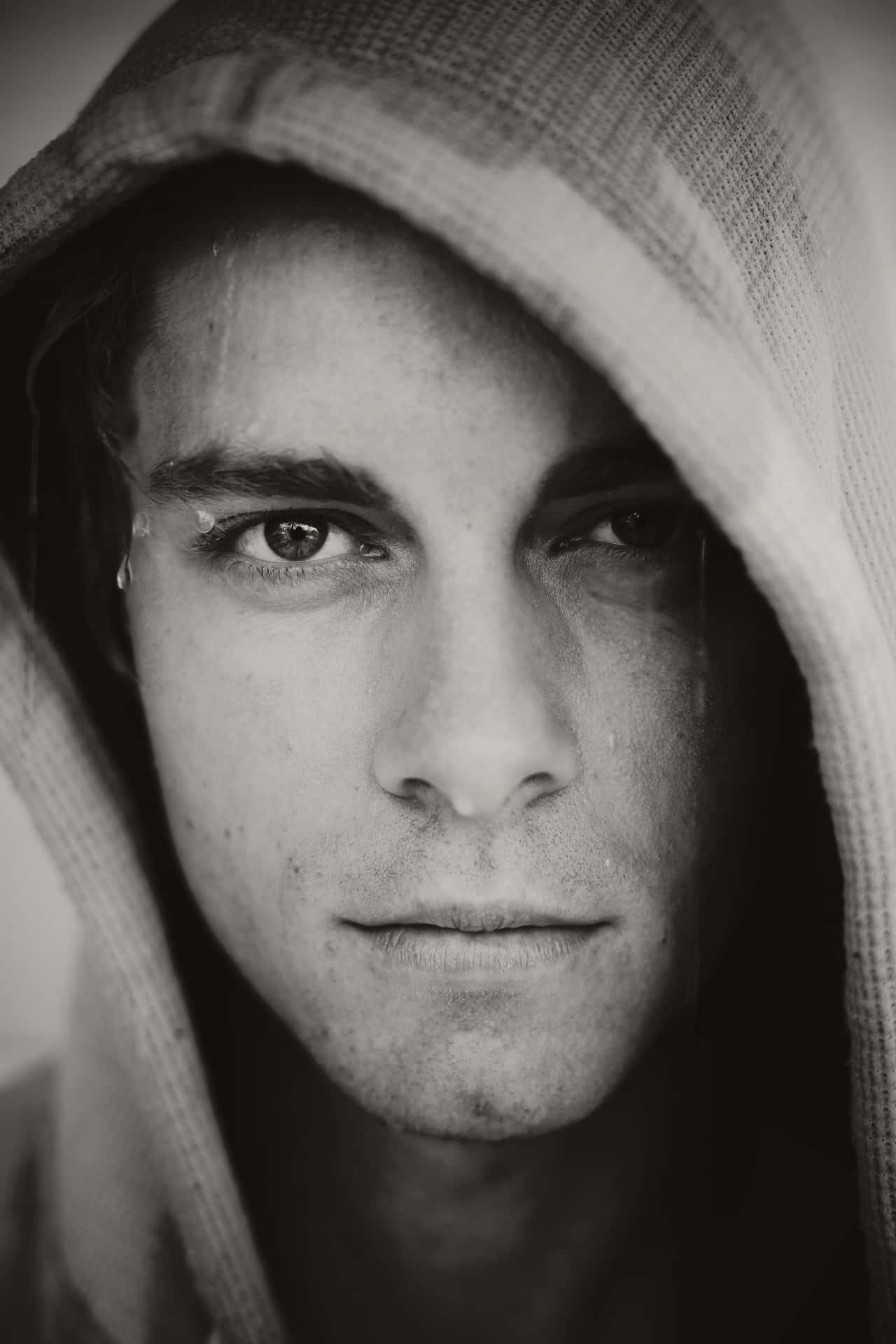 Intense_ Gaze_ Hooded_ Man_ Portrait Wallpaper