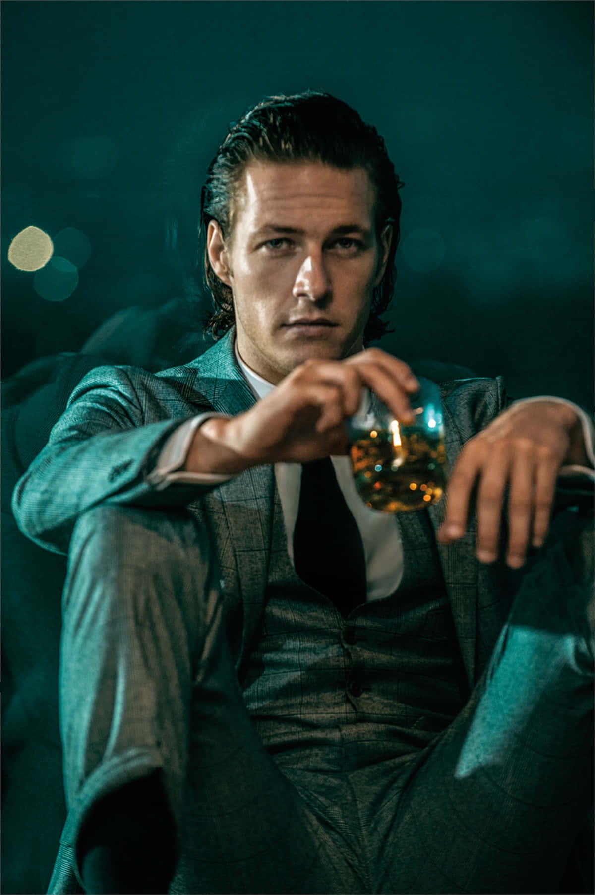 Intense Gaze Man With Whiskey Wallpaper