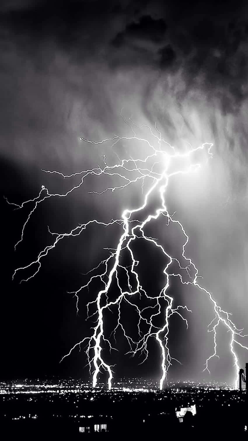 Intense Lightning Over City Night Sky Wallpaper