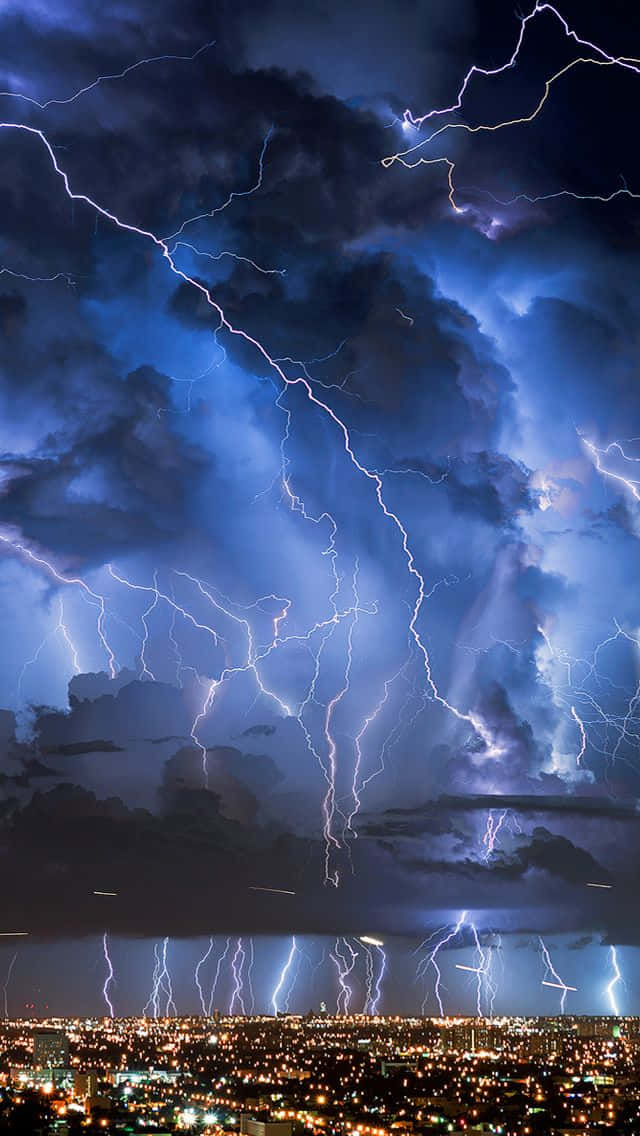Intense Nighttime Lightning Over City.jpg Wallpaper