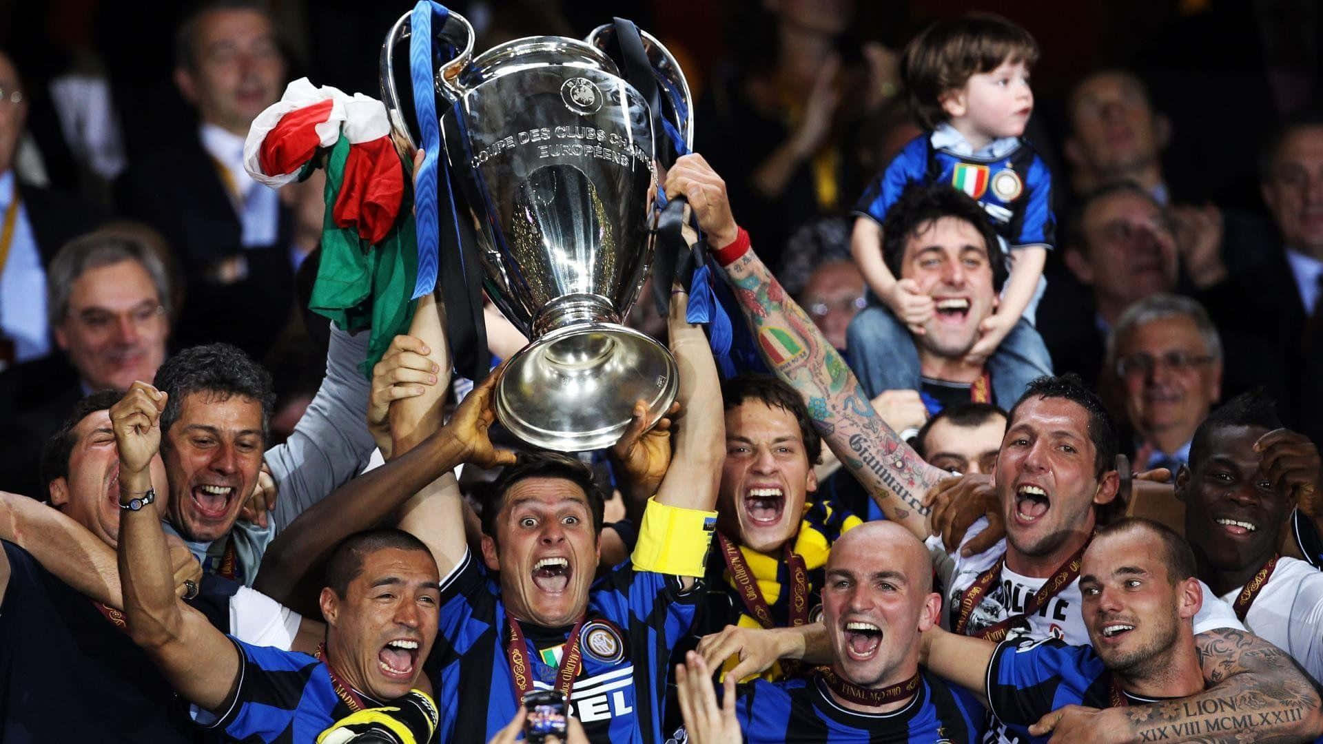 Inter Milan players celebrating a victory on the field Wallpaper