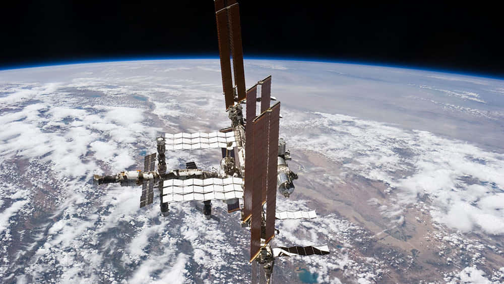The International Space Station orbiting Earth Wallpaper