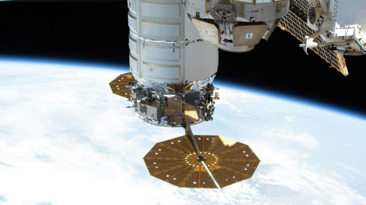 Awe-inspiring View of International Space Station Orbiting Earth Wallpaper