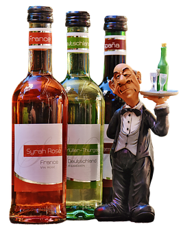 Download International Wine Selection With Waiter Figurine | Wallpapers.com