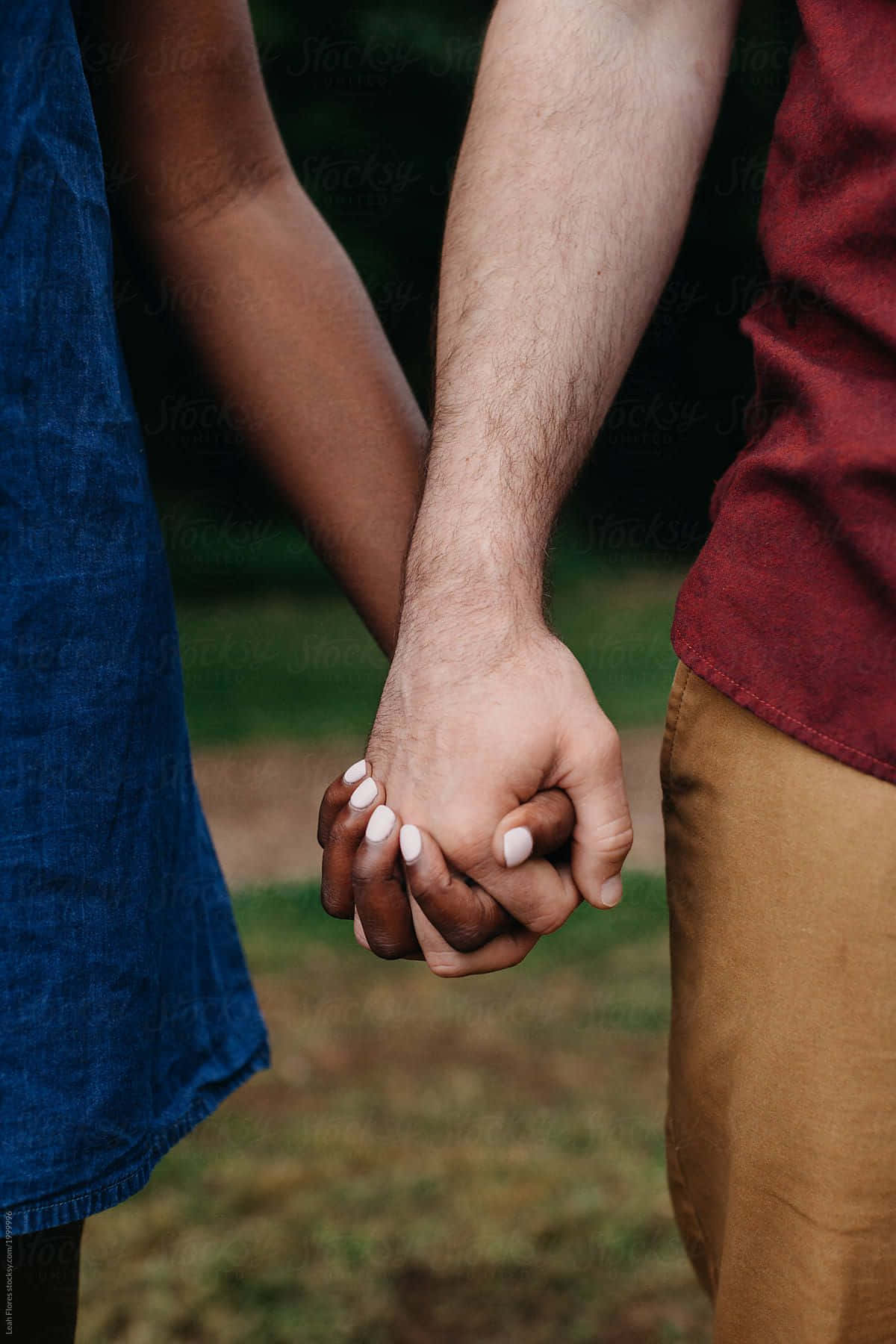 Interracial Couple Holding Hands Portrait Wallpaper