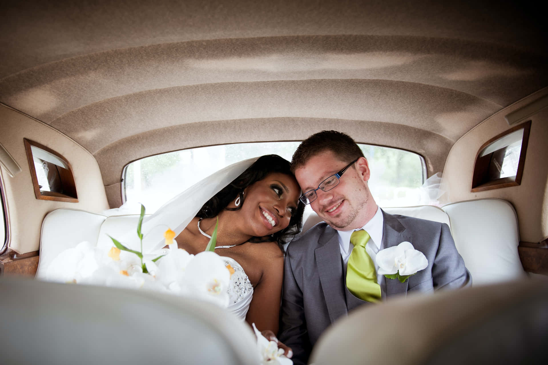 Interracial Couple In Wedding Car Wallpaper