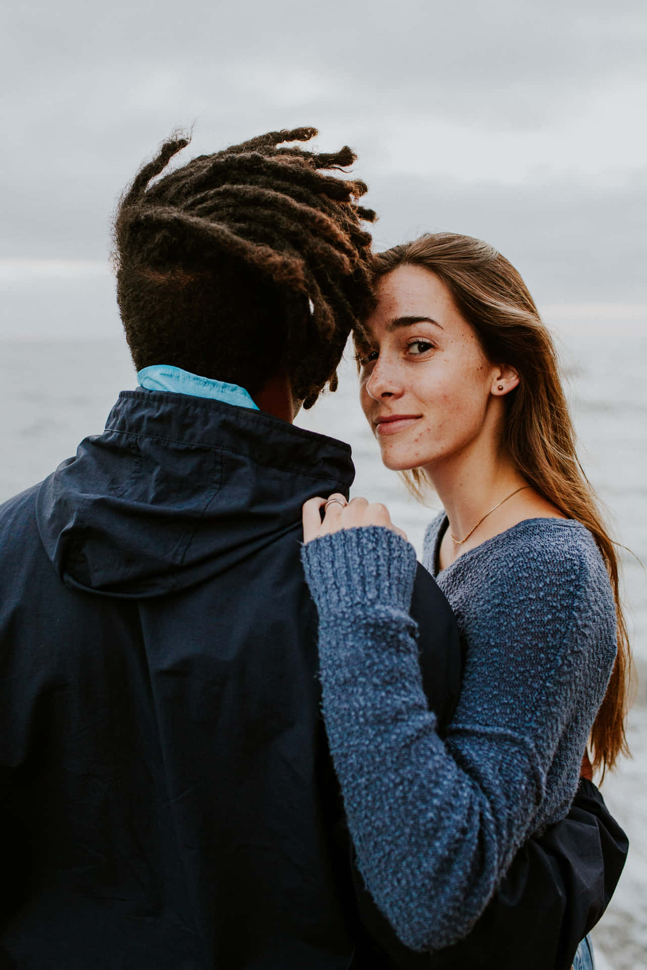 Interracial Couple Posing Outside Girl Looking Wallpaper
