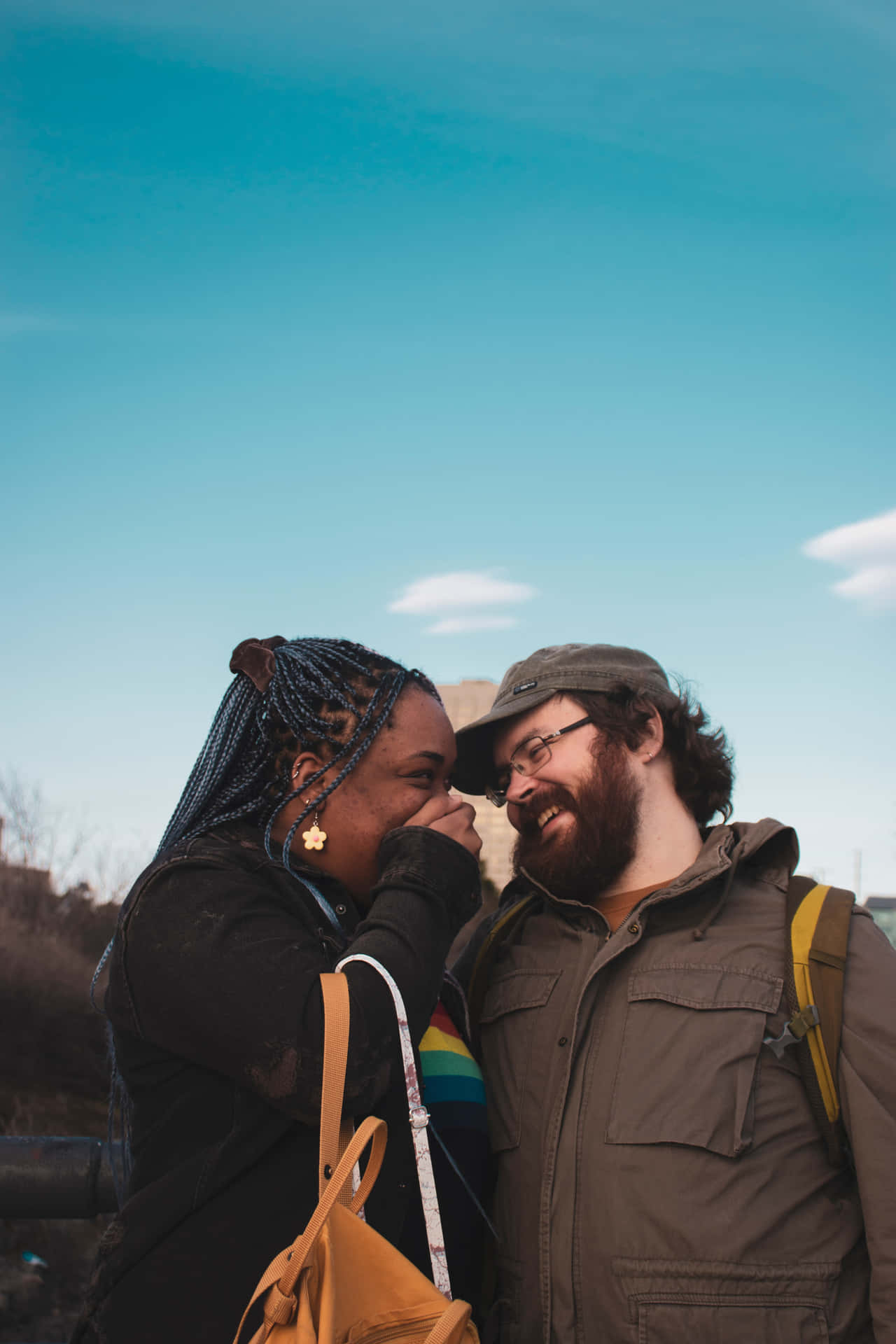 Interracial Couple Smiling Blue Skies Wallpaper