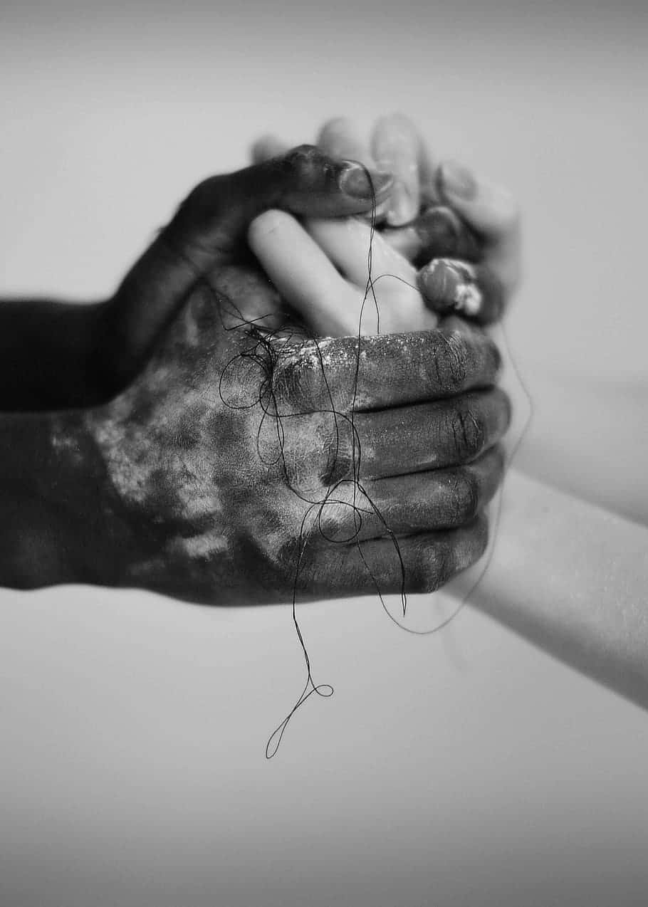 Interracial Monochrome Holding Hands Wallpaper