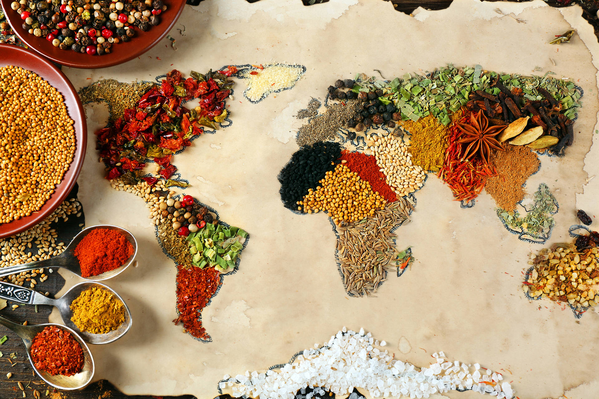 Intricate World Map Formed By Vibrant Grains Wallpaper