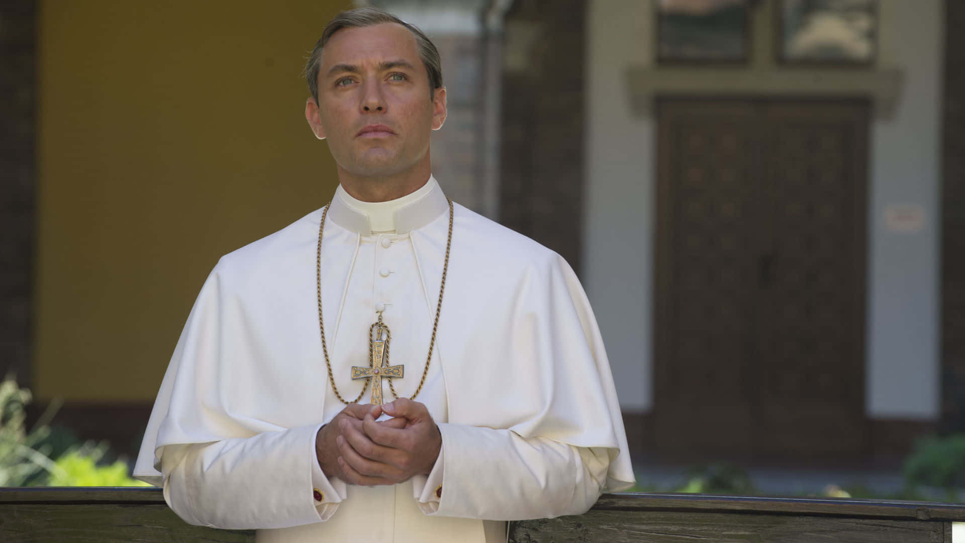 Intriguing Young Pope Glancing Sideways Wallpaper