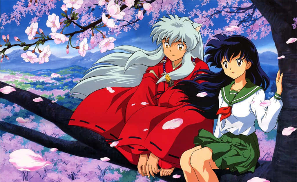 Inuyasha and Kagome share a tender moment in a beautiful forest landscape Wallpaper