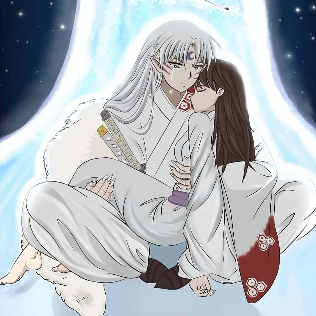 Inuyasha and Rin sharing a close moment in the enchanted forest Wallpaper