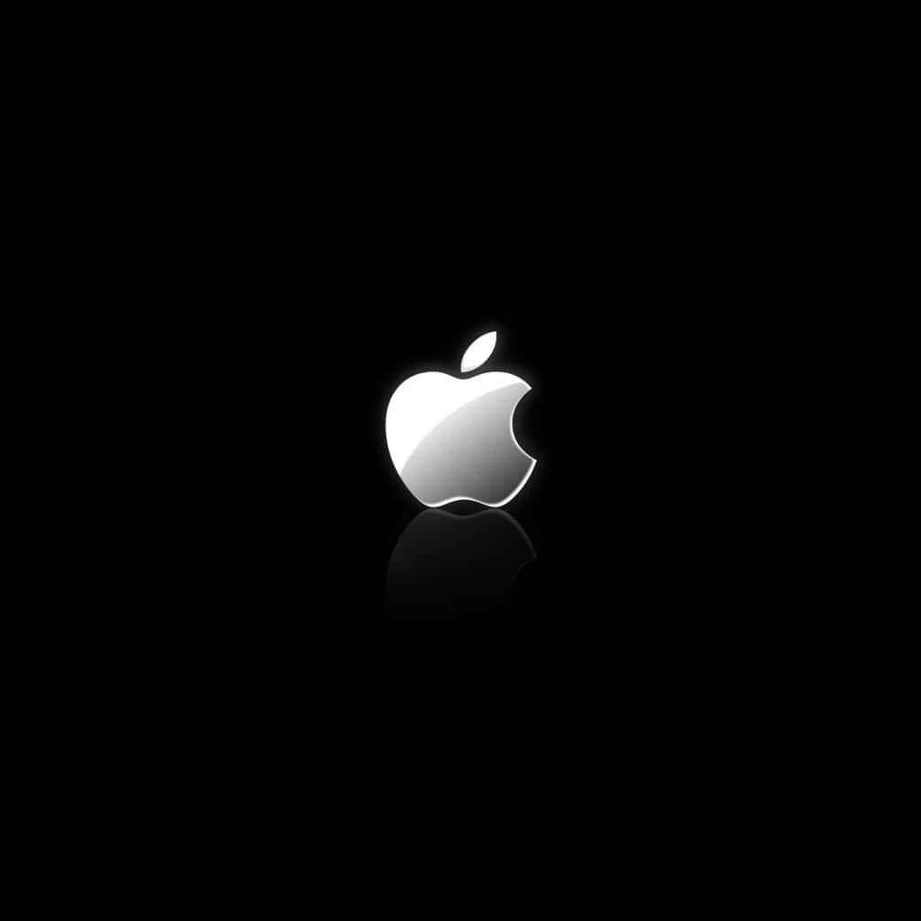 Download Apple Logo On A Black Background Wallpaper | Wallpapers.com