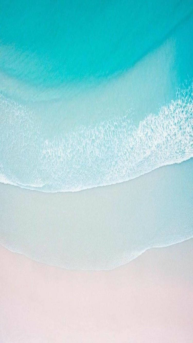 Take in the serenity of a sandy beach with the new iPhone 11 Wallpaper