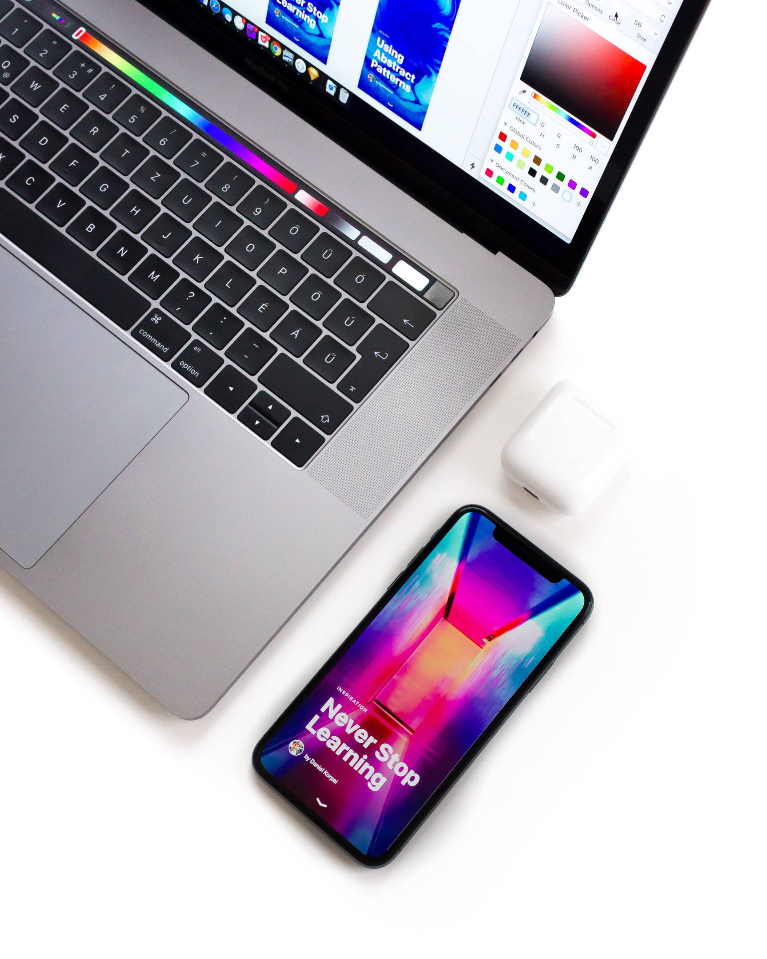 Iphone Desk With Colorful Phone Screen Wallpaper