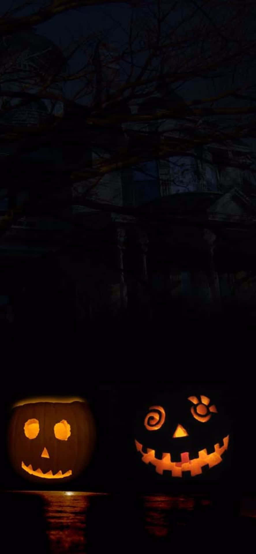 Läskigajack O'lanterns För Iphone Halloween-bakgrund.