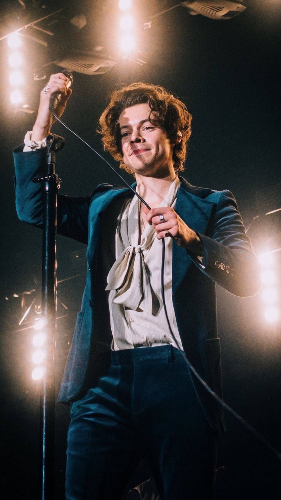 Iphone Harry Styles Adjusting The Microphone Wire Wallpaper