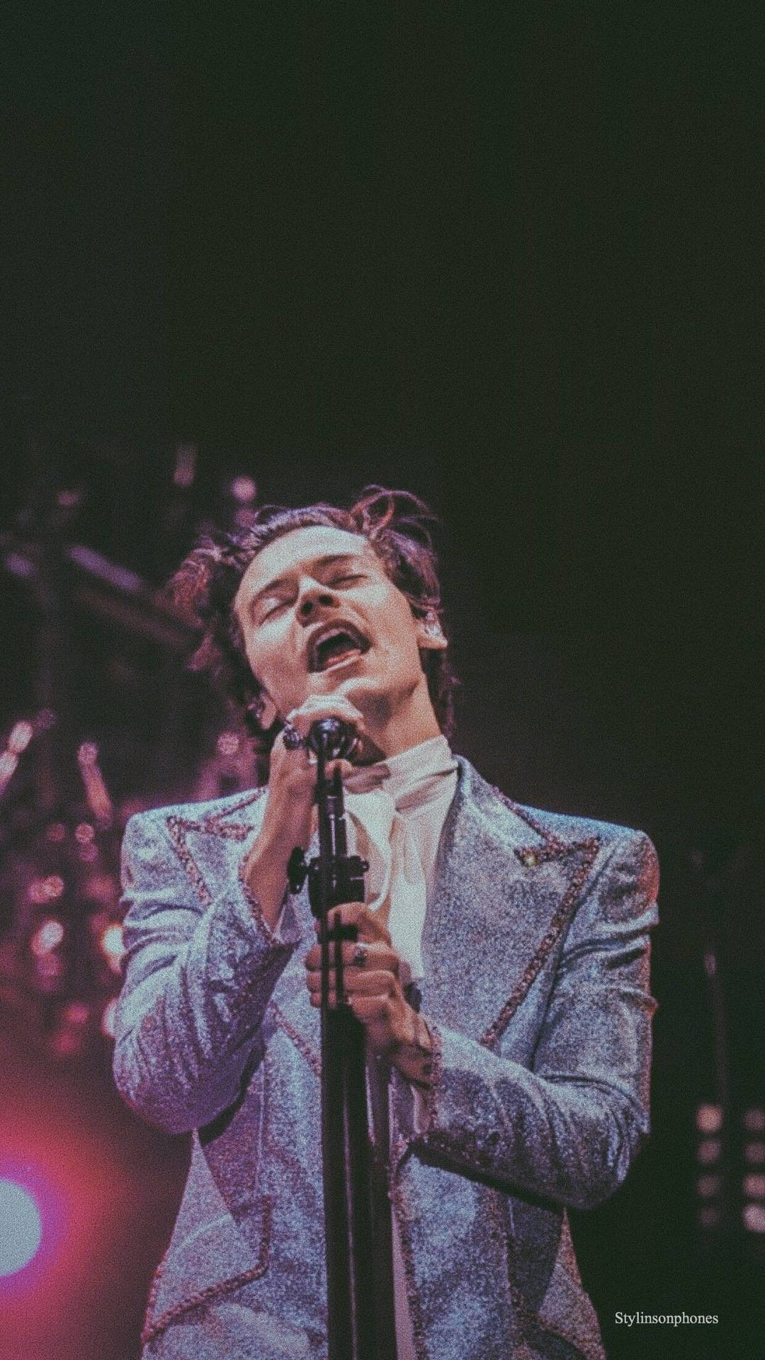 Enjoy Listening Music While You're On-the-go with the Harry Styles iPhone Wallpaper