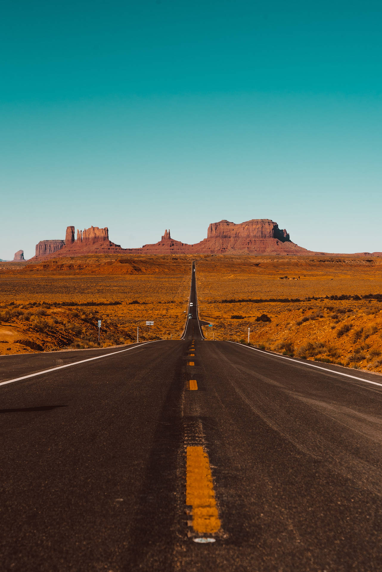 Iphonelandskapsbakgrundsväg Till Monument Valley. Wallpaper