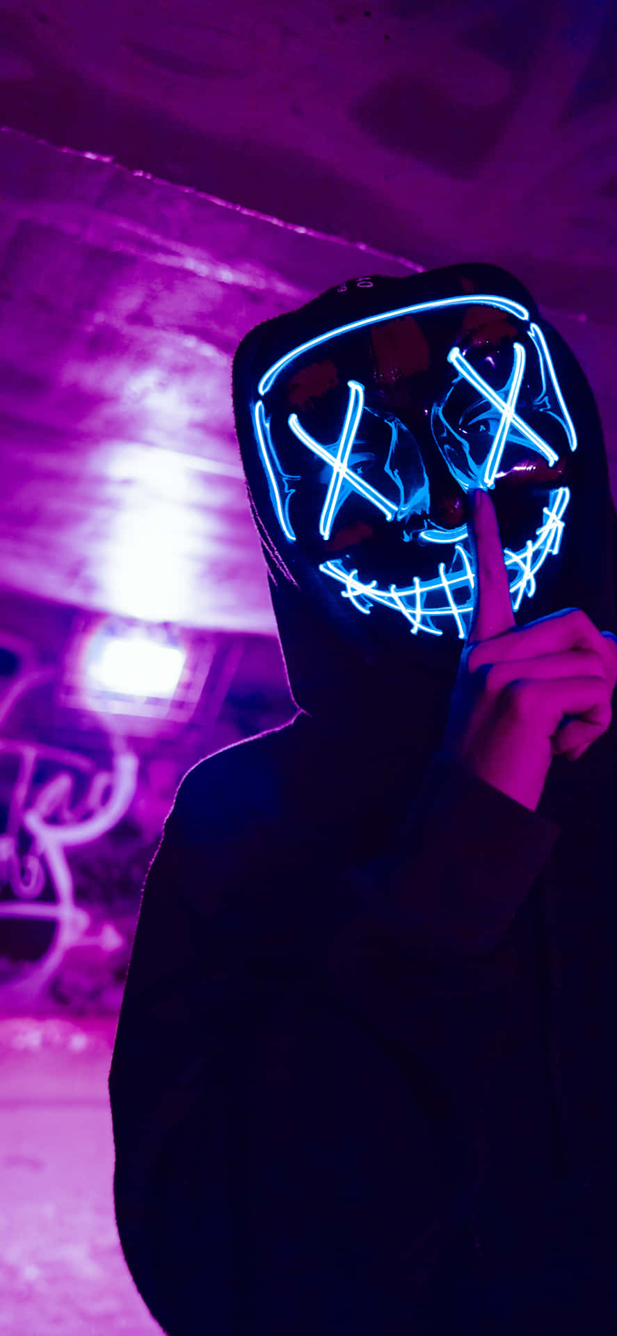 A Person Wearing A Neon Mask