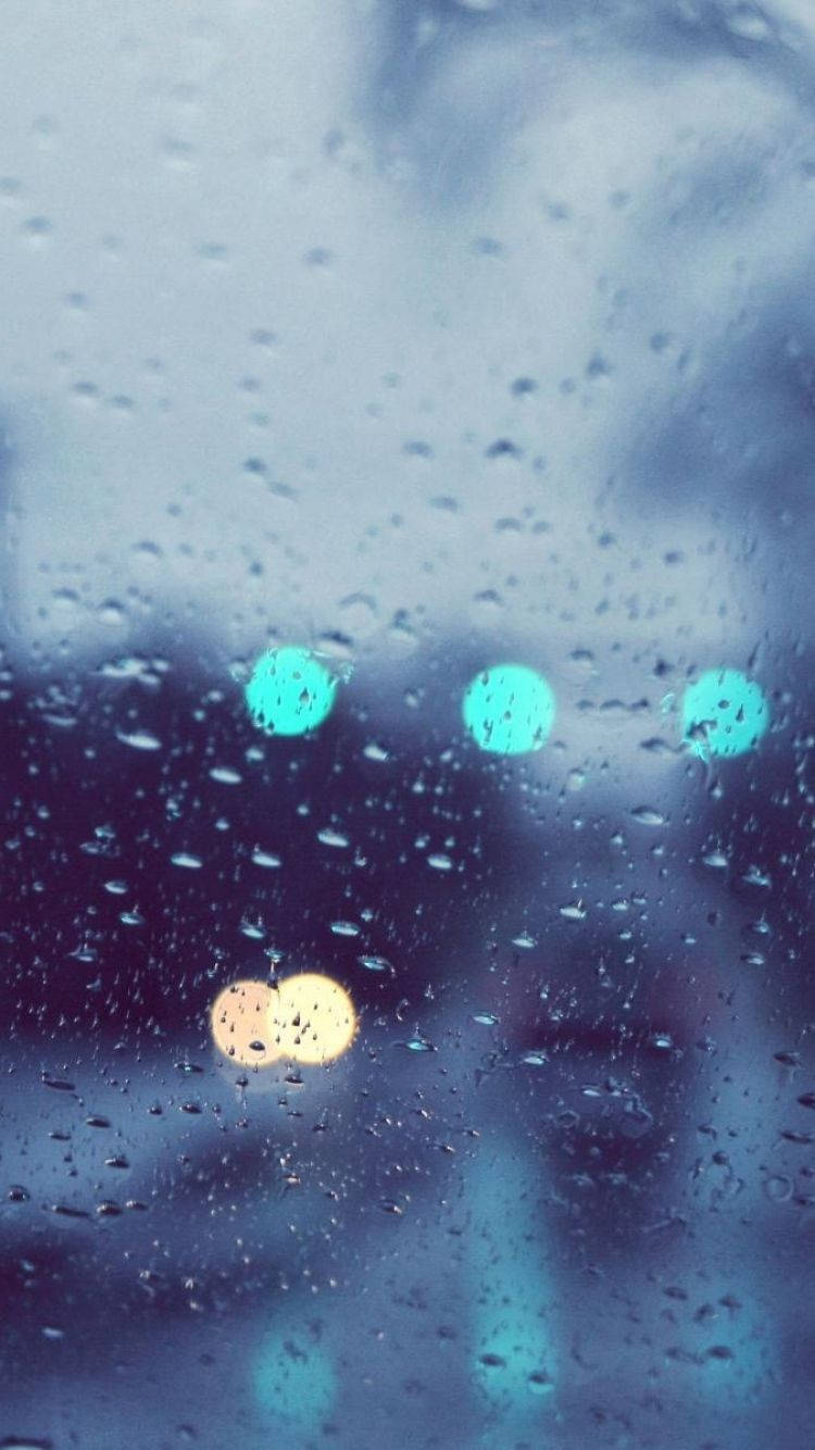 Enjoy the serene moment of the rain with your Iphone Wallpaper