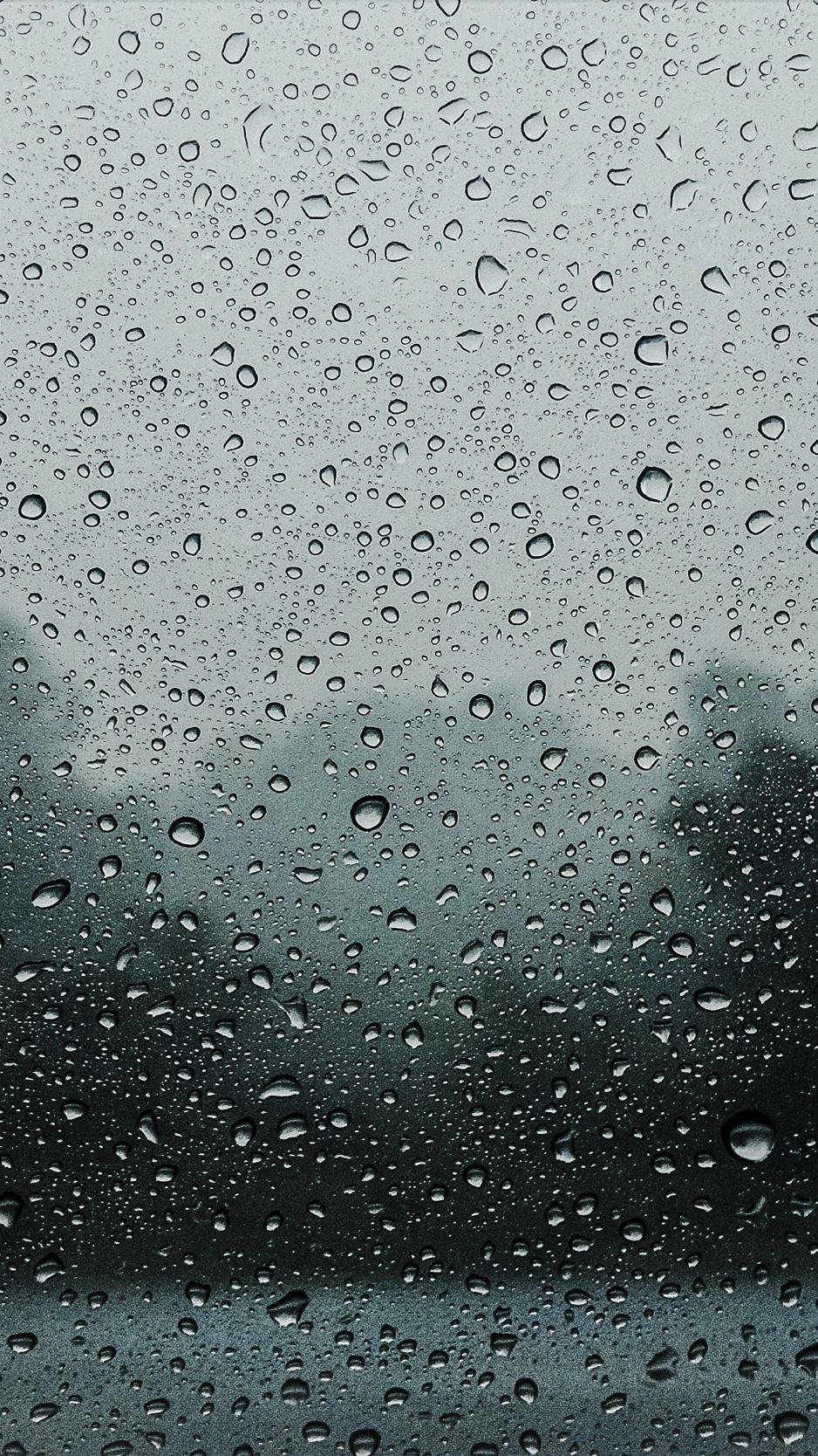 "A view of the wet city through an Iphone" Wallpaper