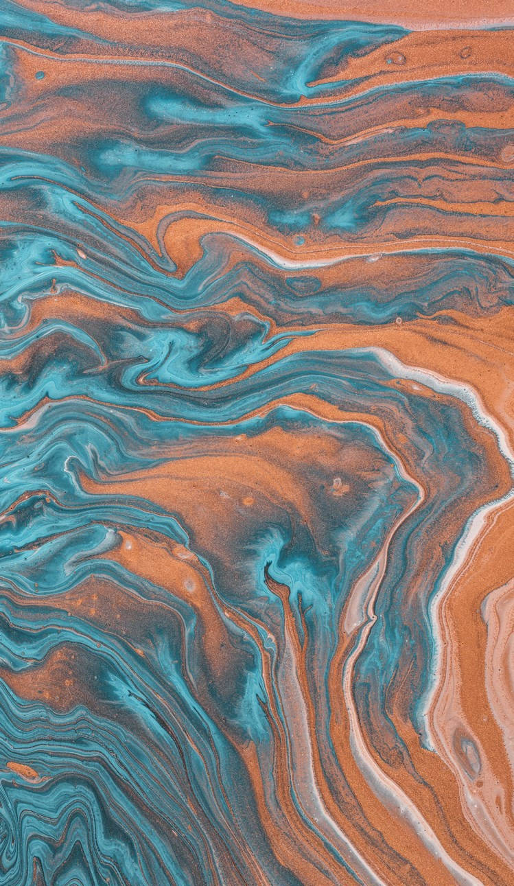 En blå og orange væske med svøbninger Wallpaper