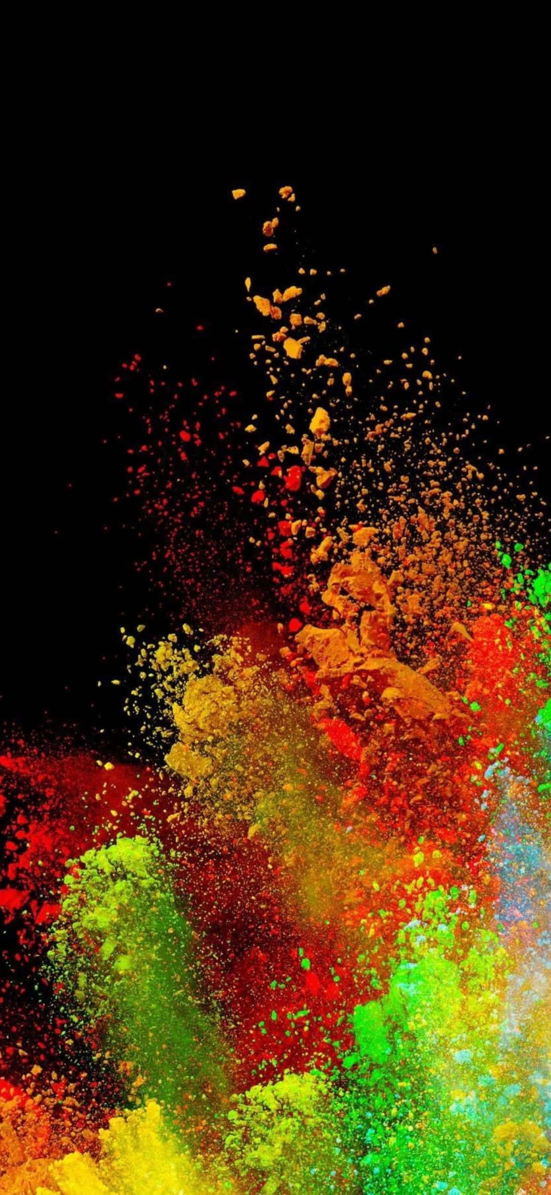 colorful powder falling on a black background