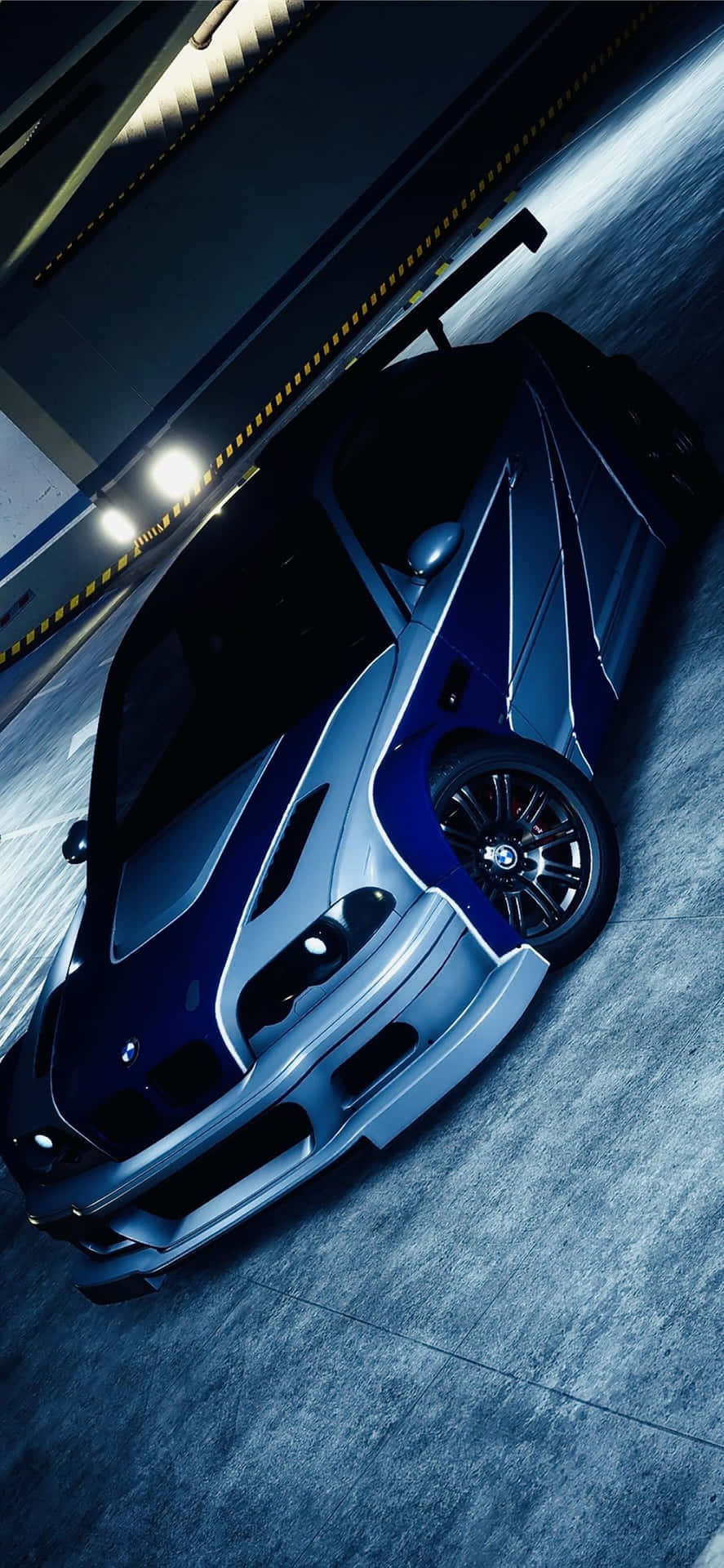 A Blue And White Car In A Dark Garage