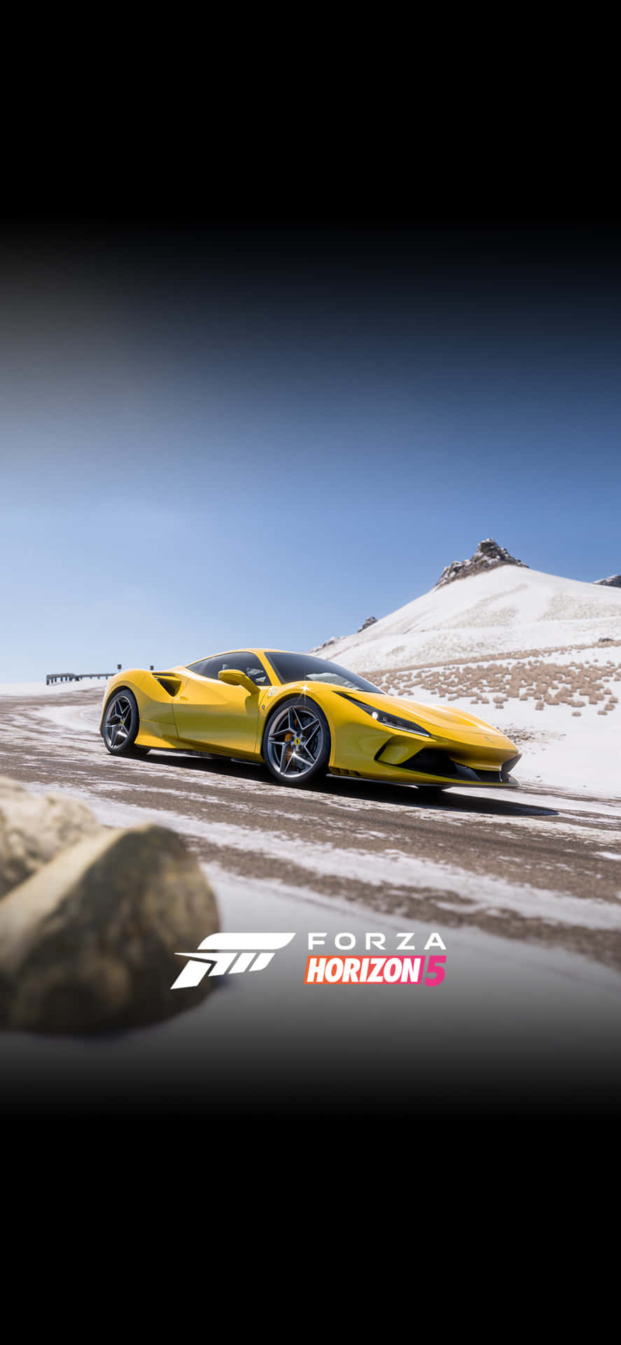 A Yellow Car Driving On A Snowy Mountain