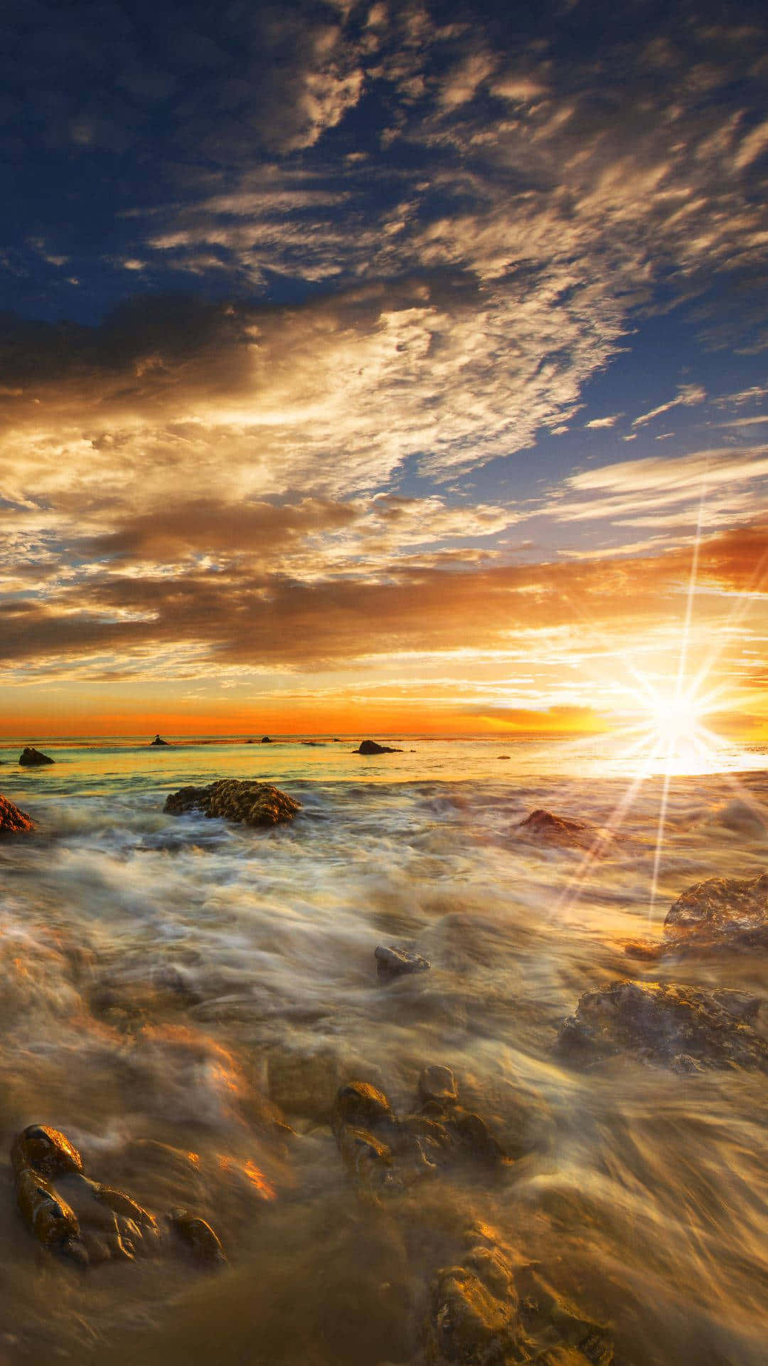 Iphonex Malibu-bakgrund Med Lysande Oceanvåg.