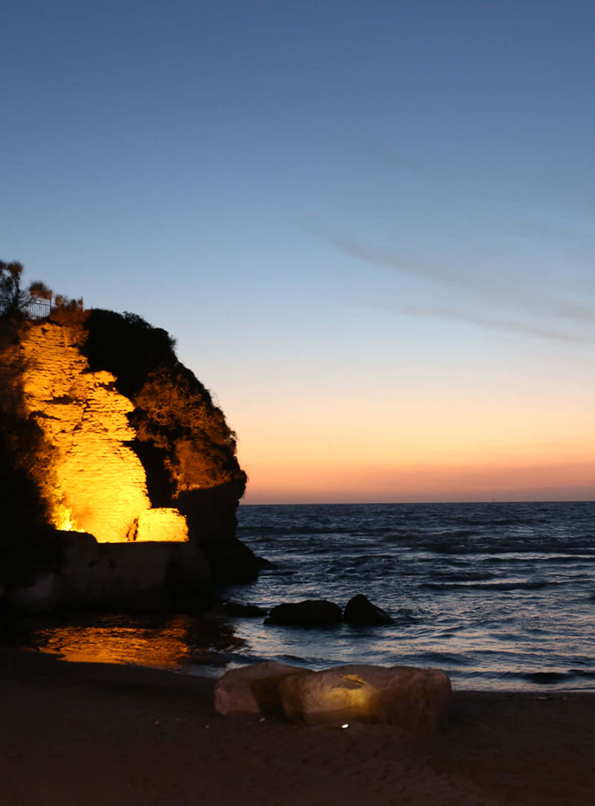 Baggrundsild for Iphone X Fire Light på kysten scene i Malibu