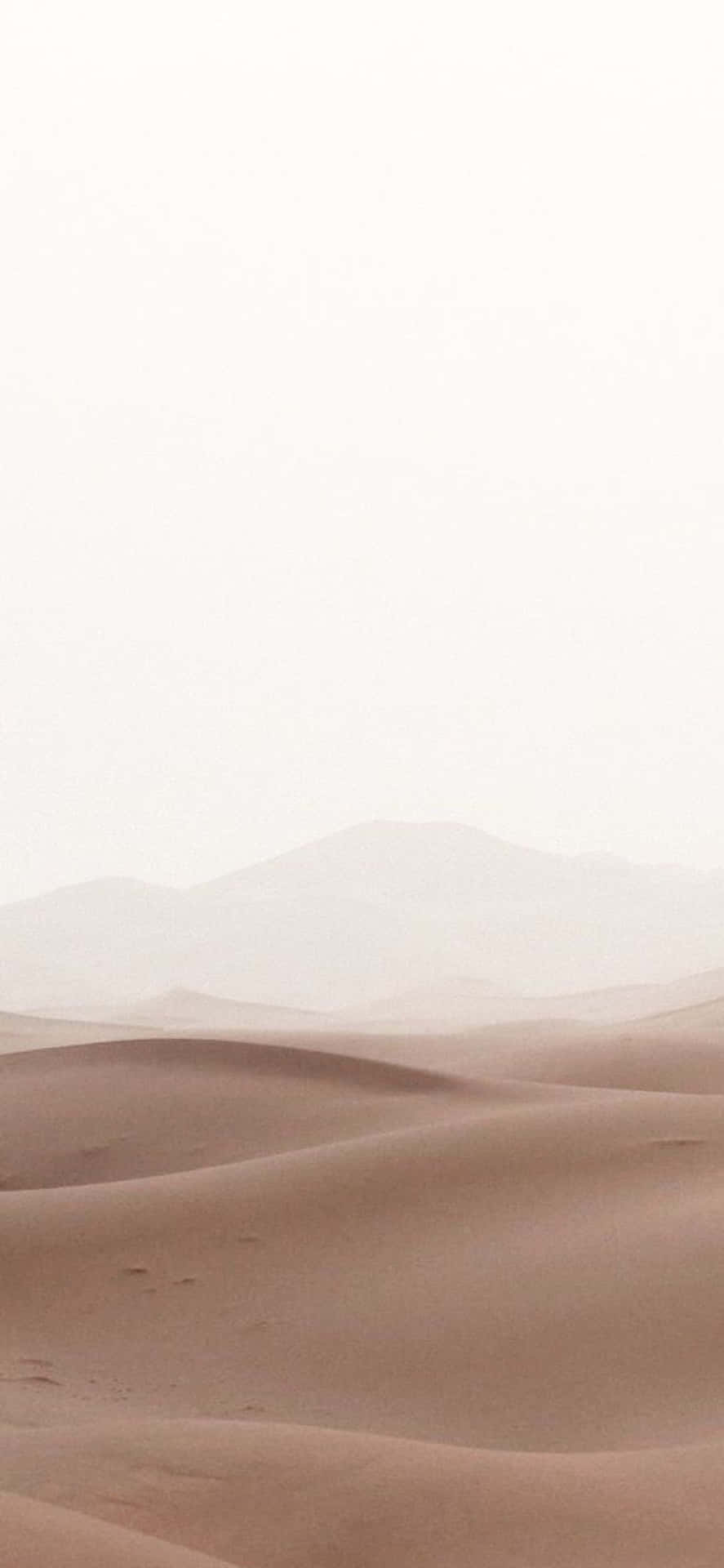 Minimalist shot of a dune against sky in desert stock photo