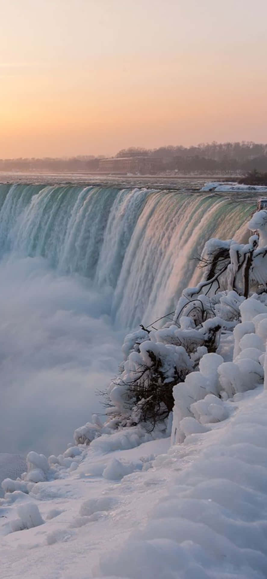 Iphonex Bakgrundsbild Med Snö Vid Niagara Falls.