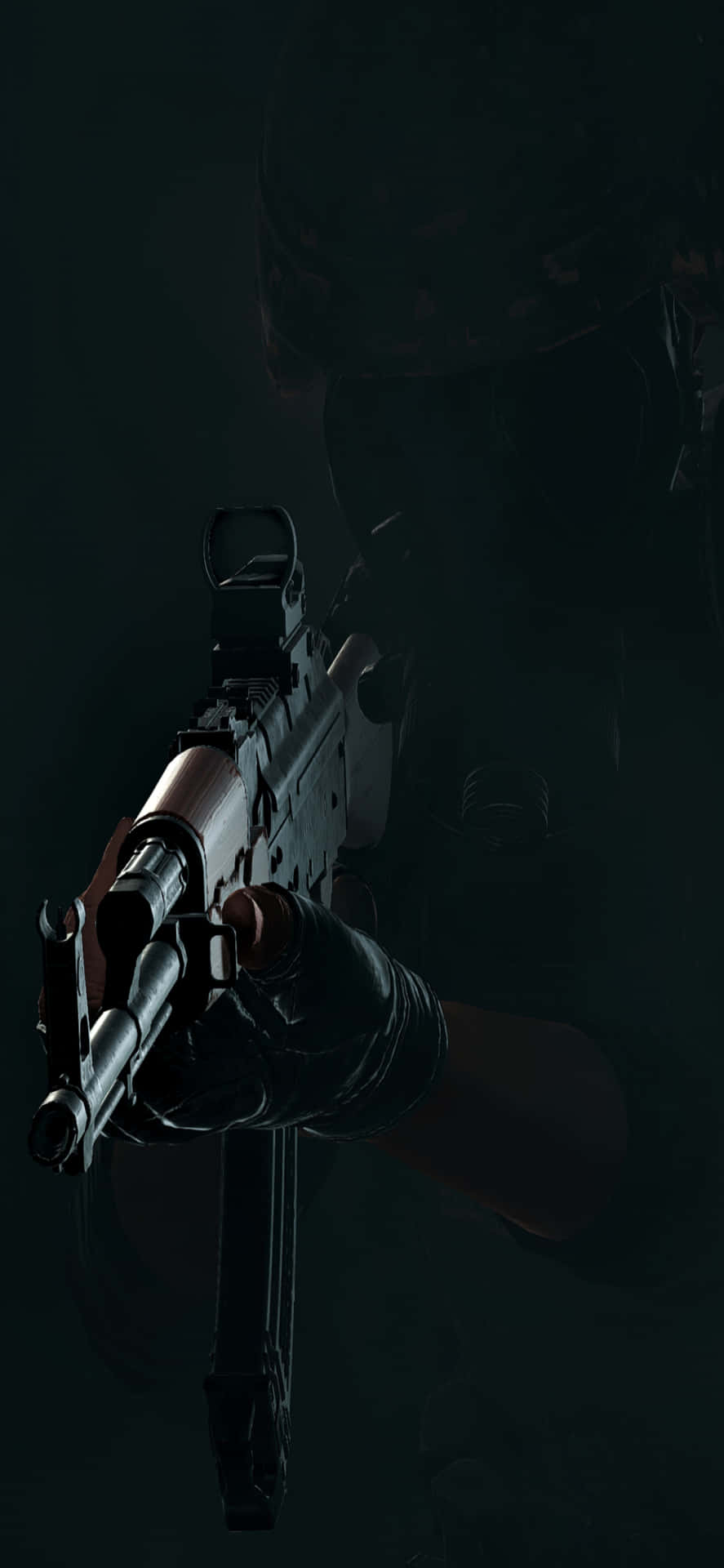 a soldier holding a gun in the dark