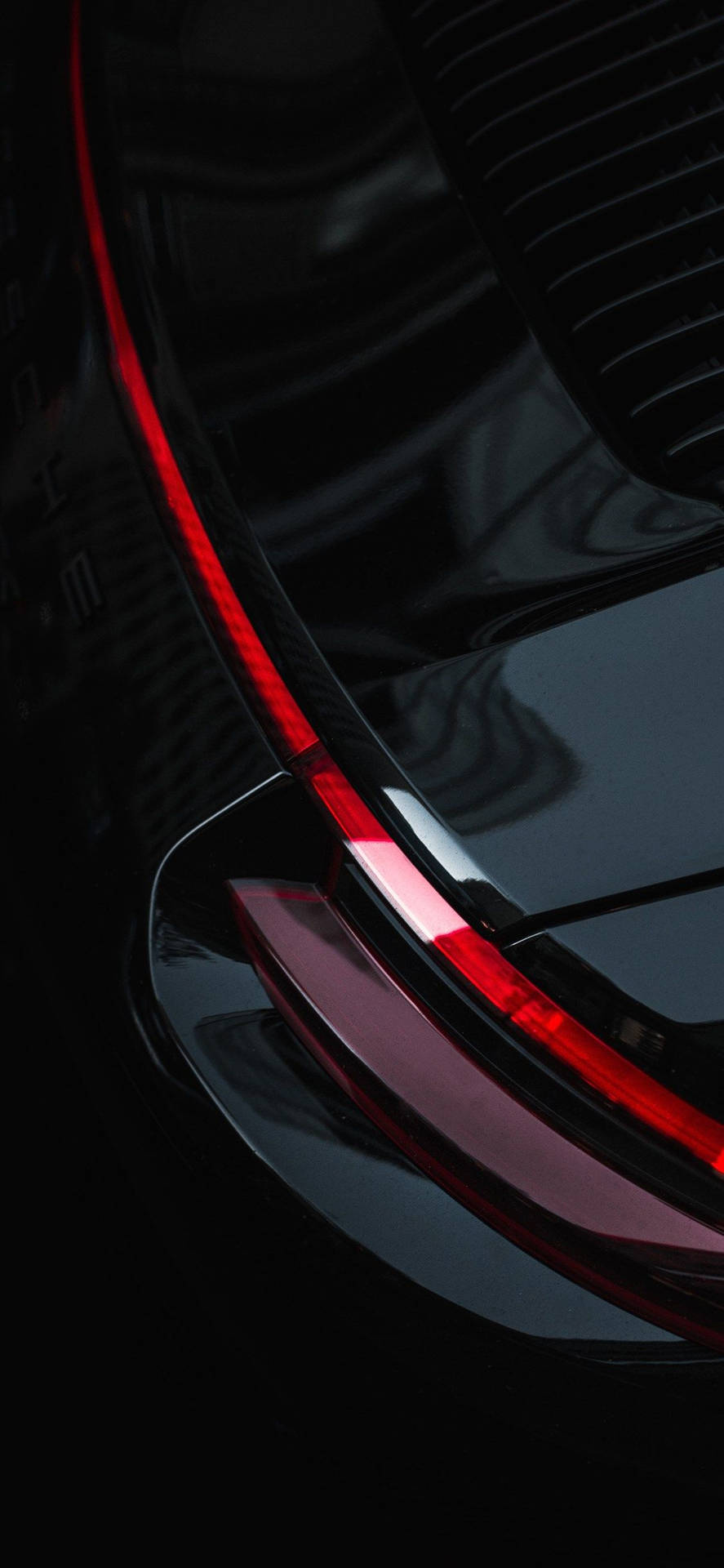 Reflecting the Luxury of the iPhone XR with a Black Car on a Fiery Road. Wallpaper