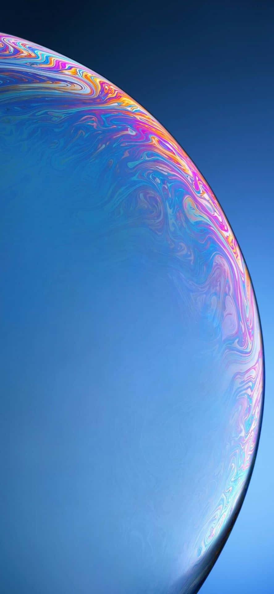 A Close Up Of A Blue Bubble With A Colorful Background
