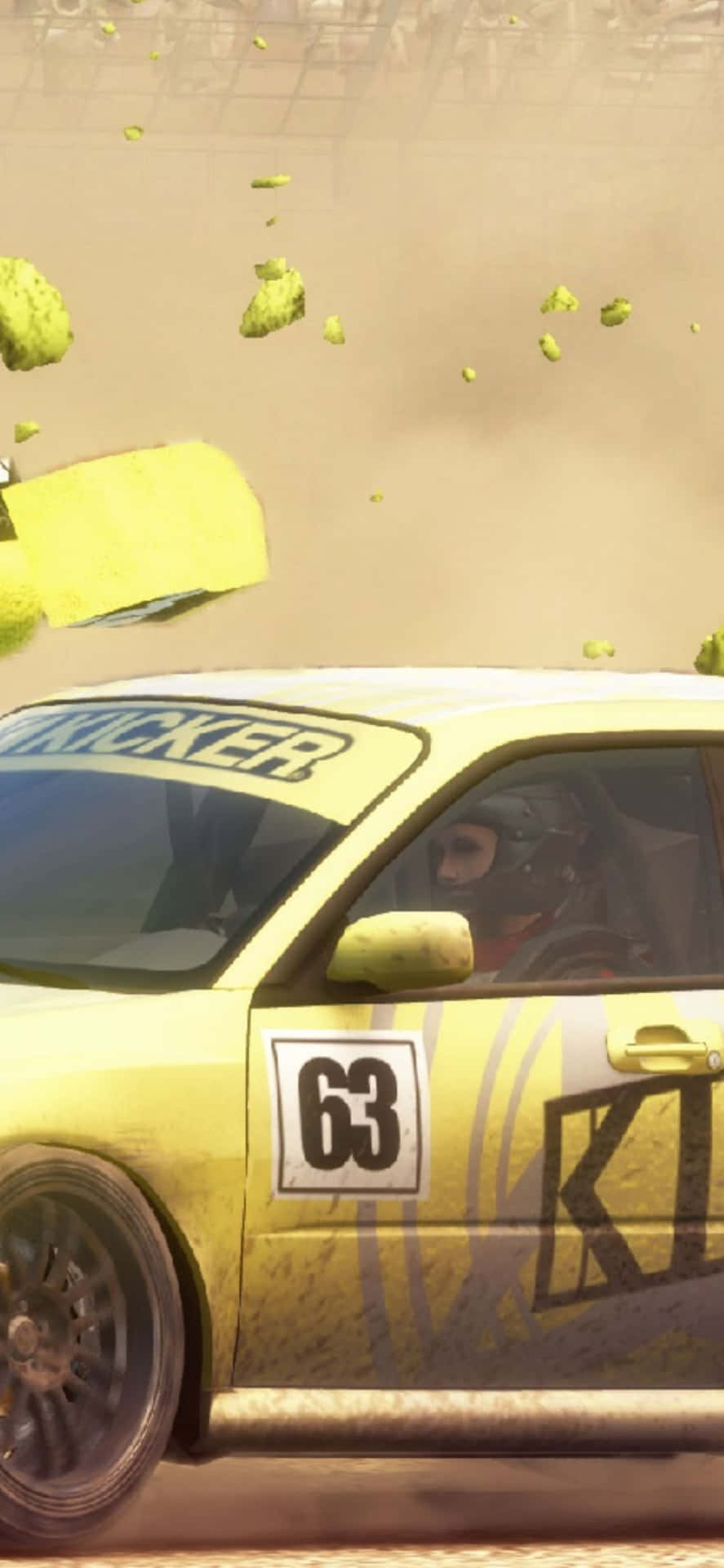A Yellow Car Is Driving Through The Dirt