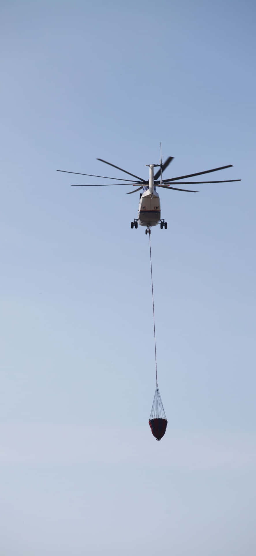 Nyd turen af et livstid i himlen med iPhone Xs Max Helikoptere Tapet