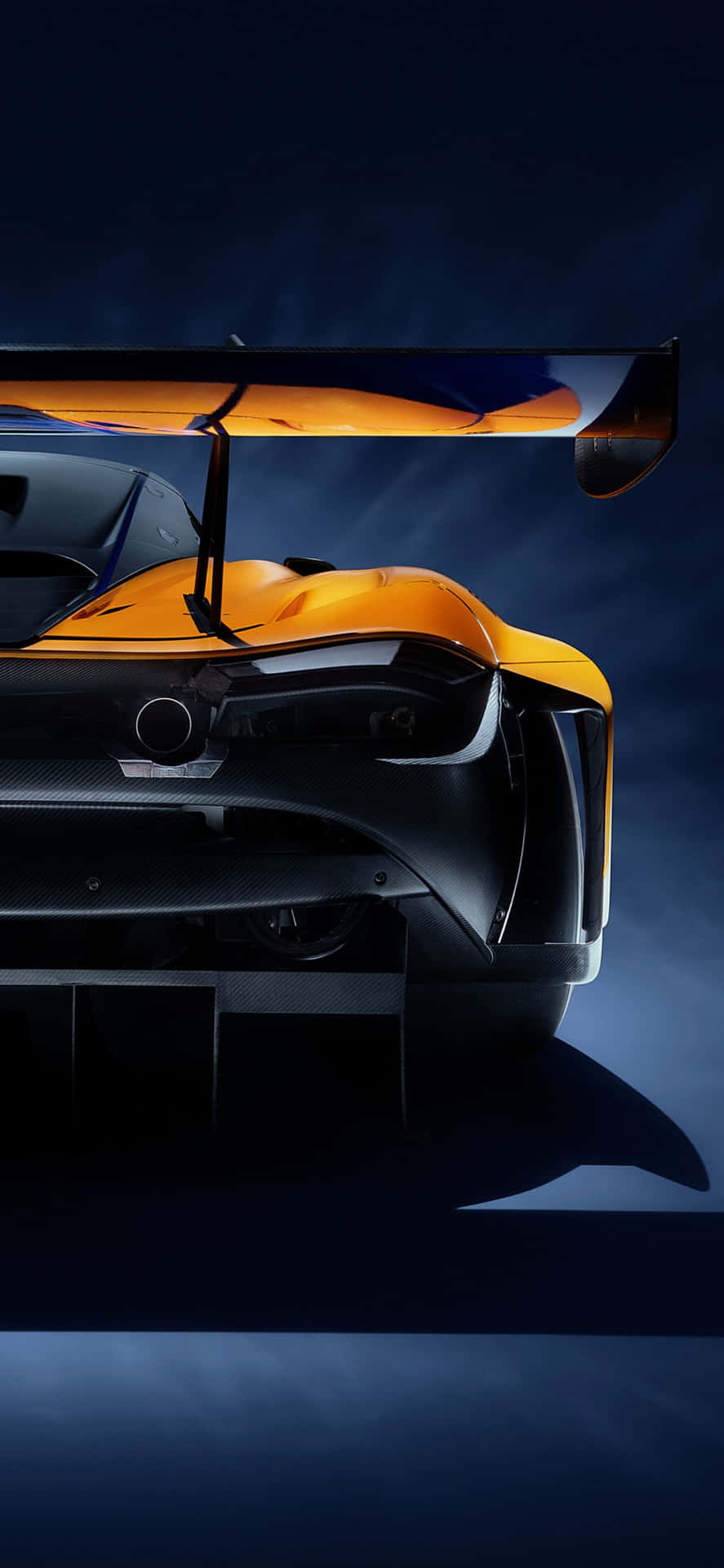 The Apple Iphone Xs Max alongside a Mclaren 720s sports car in an impressive background.