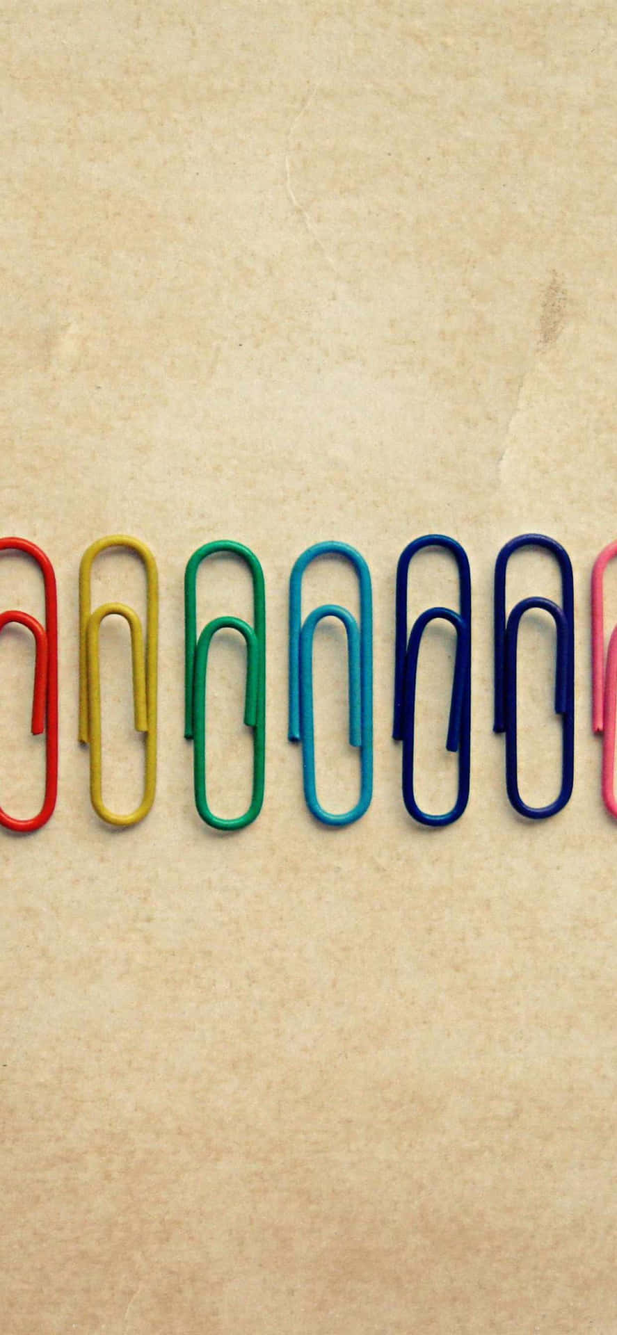 A Row Of Colored Paper Clips
