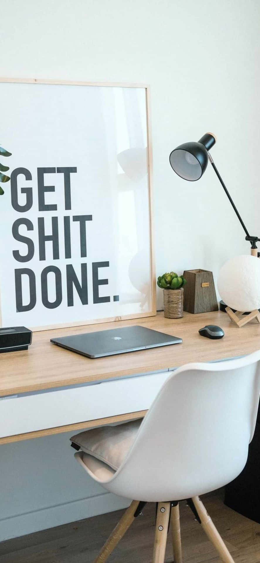 A Desk With A Poster That Says Get Shit Done