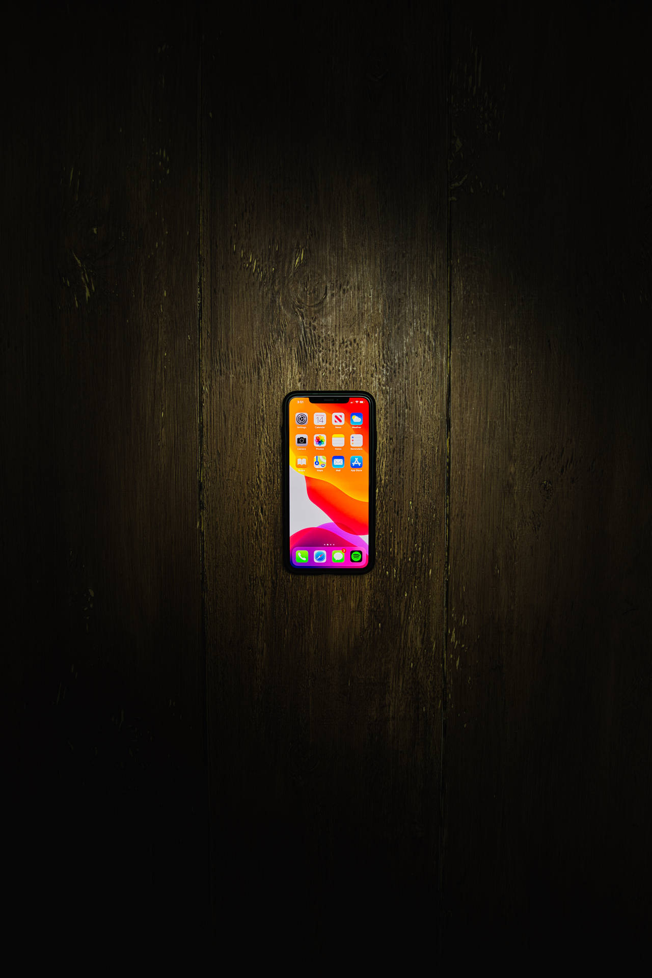 Iphone Xs Max On Wooden Floor Wallpaper