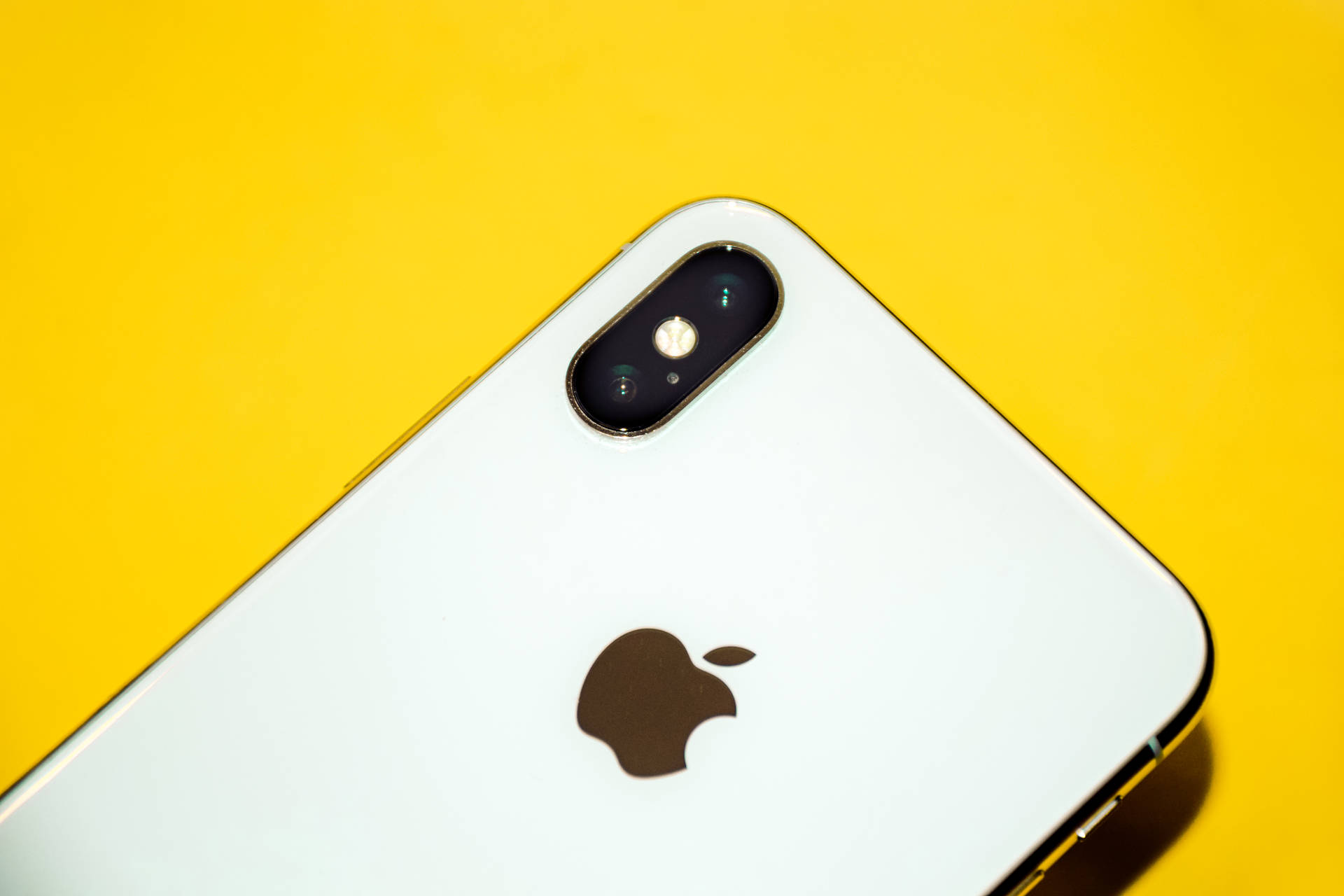 Iphone Xs Max On Yellow Wallpaper