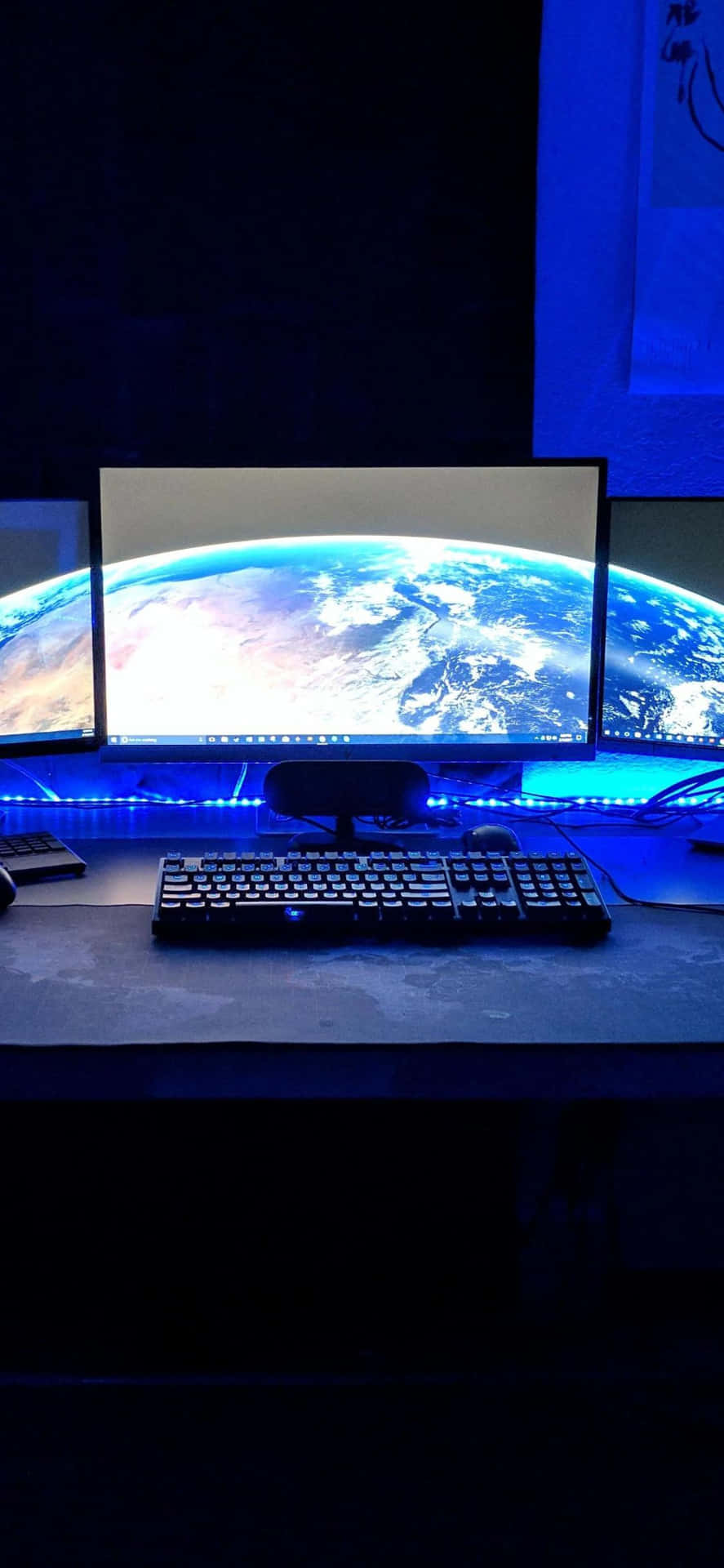 A Desk With Three Monitors