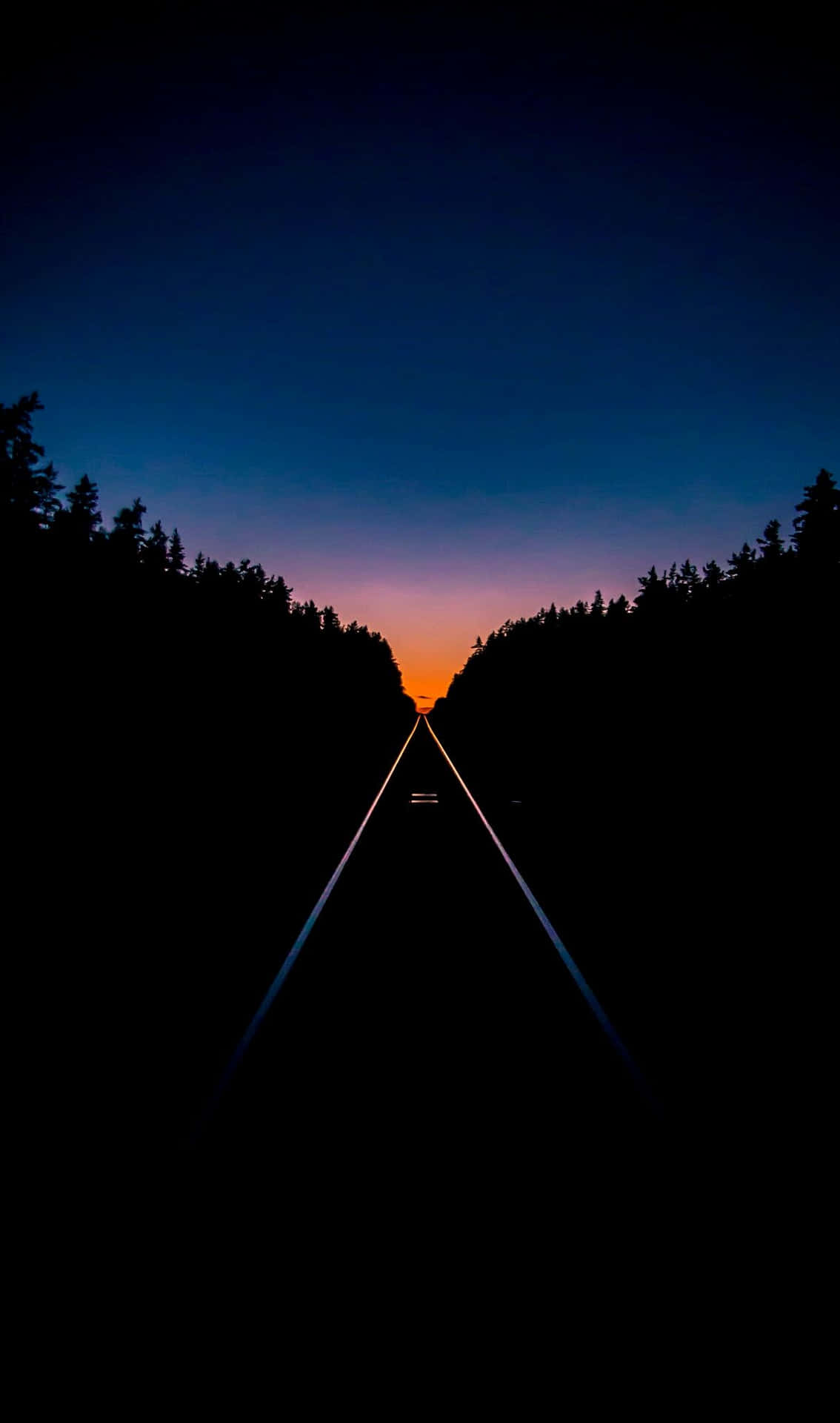 Mørk og tom vej iPhone XS OLED-baggrund