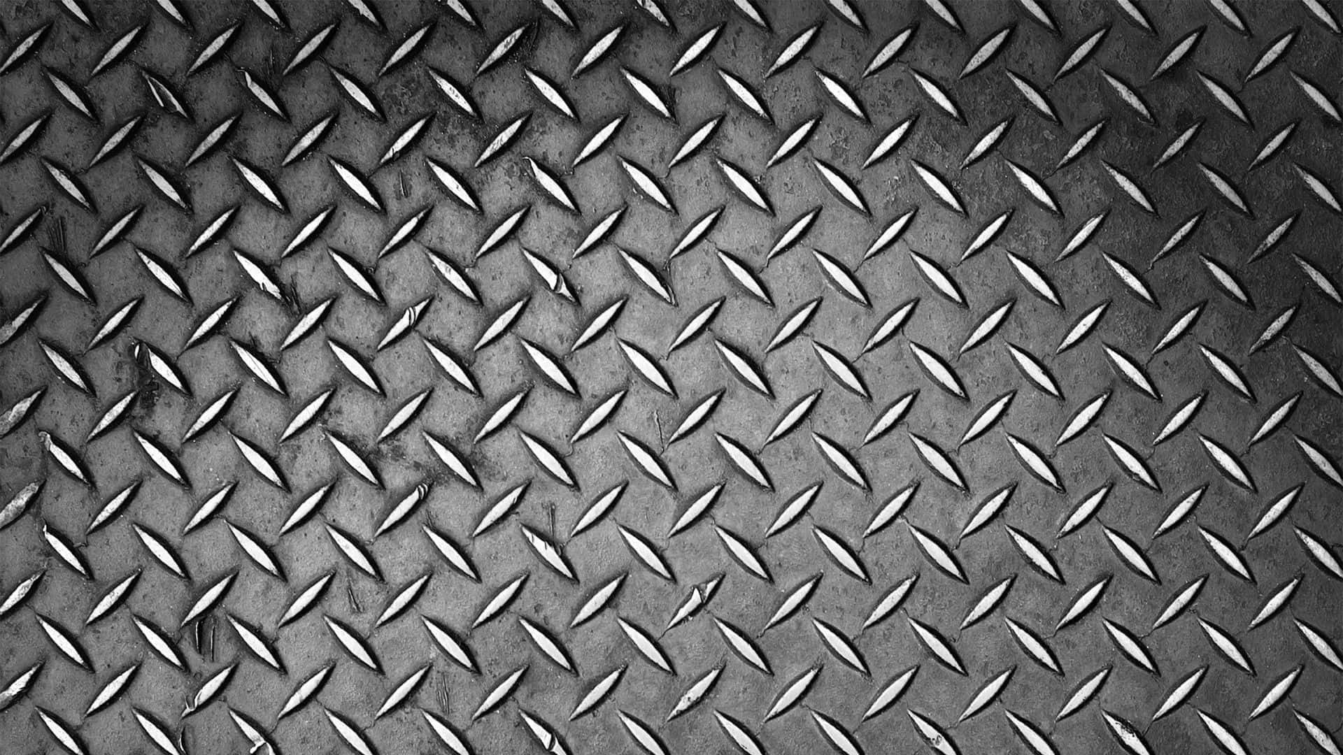 A Black And White Photo Of A Metal Plate
